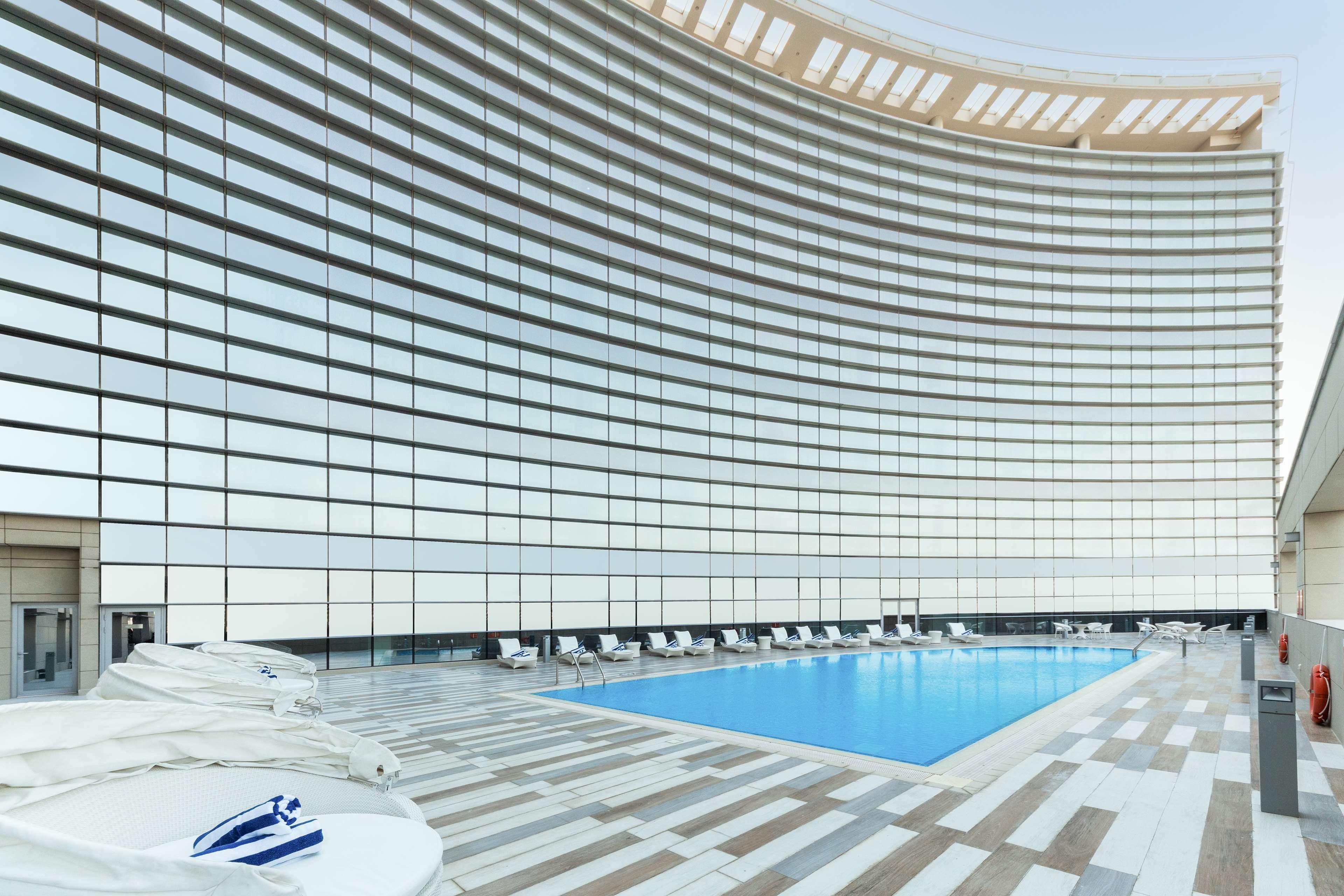 Hotel Dusitd2 Salwa Ad Dawhah Esterno foto The pool at the 101