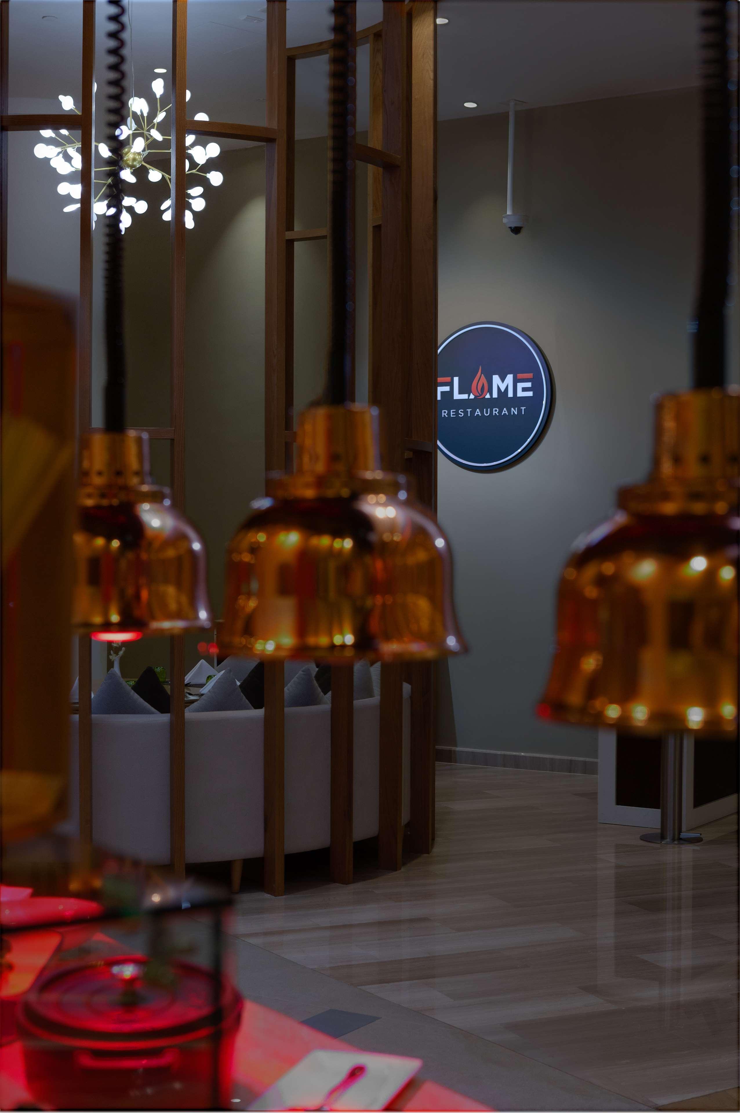 Hotel Dusitd2 Salwa Ad Dawhah Esterno foto FLAME Restaurant